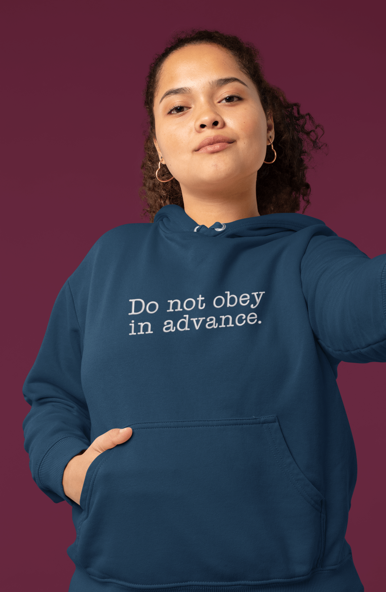 mockup-of-a-serious-young-woman-with-a-hoodie-taking-a-selfie-32000